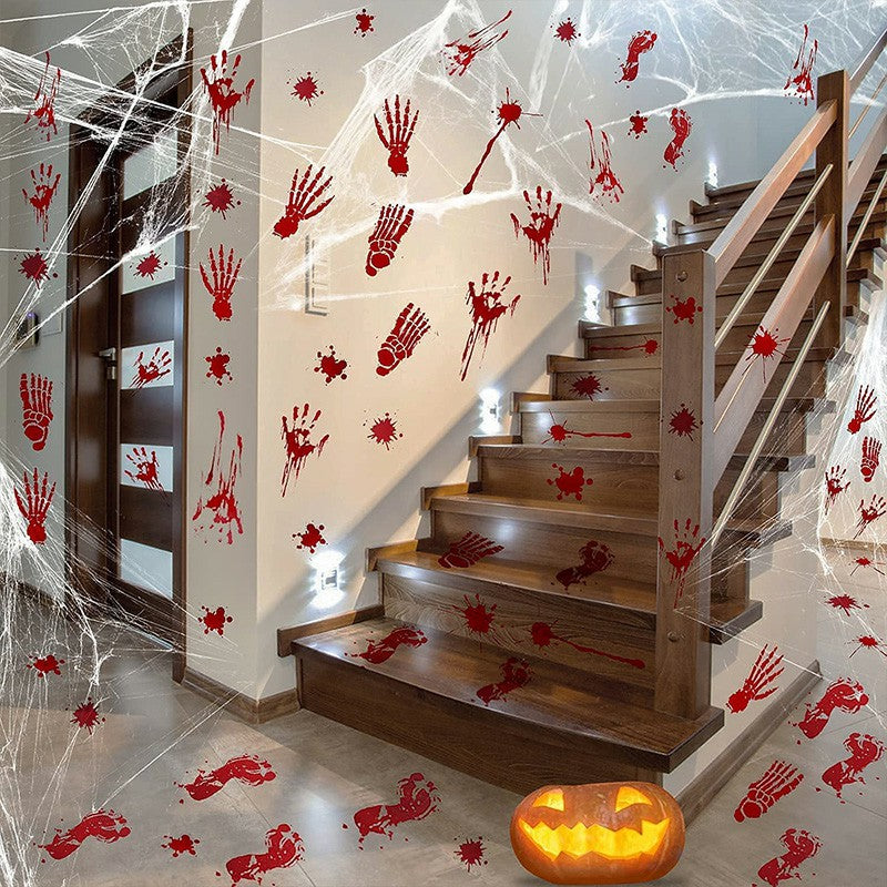 Halloween bloody handprint stickers decorating staircase walls and floor with spider webs